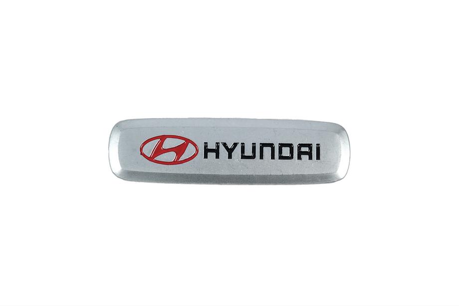 Hyundai Emblemat aluminiowy do dywaników (1 szt) Image