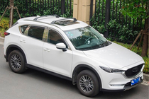 Mazda CX-5 2017–2025 Belki poprzeczne bagażnika dachowego na relingi zintegrowane OEM (2 szt.) zdjęcia 2
