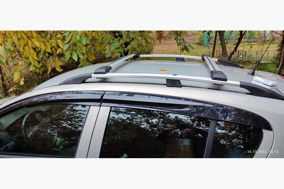 Opel Astra H 2004-2013 Bagażnik dachowy na standardowe relingi zamykany na klucz (2 szt.) Image