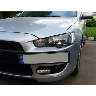 Ramka na tablice rejestracyjna (plastik) Mitsubishi Lancer X 2008- zdjęcia 2