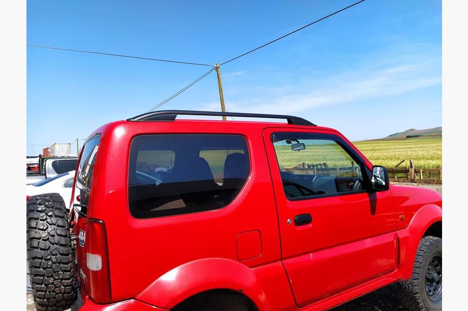 Suzuki Jimny 1998-2018 Relingi dachowe Skyport (czarne) Image