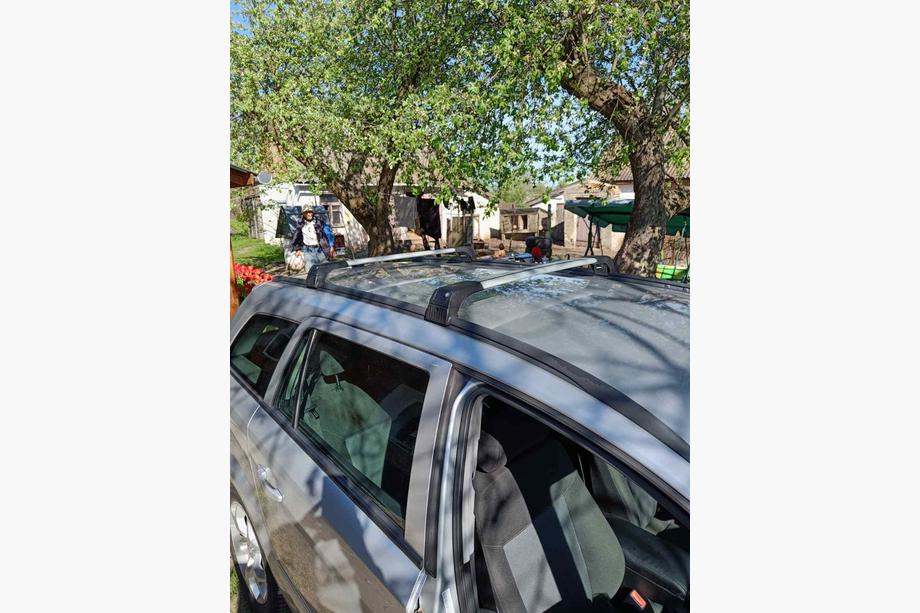 Opel Astra H 2004-2013 Bagażnik dachowy na zintegrowane relingi zamykany na klucz Skybar V2 (2 szt.) Czarne Image