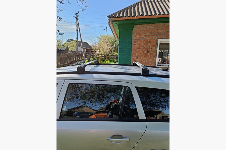 Opel Astra H 2004-2013 Bagażnik dachowy na zintegrowane relingi zamykany na klucz Skybar V2 (2 szt.) Zdjęcia 12